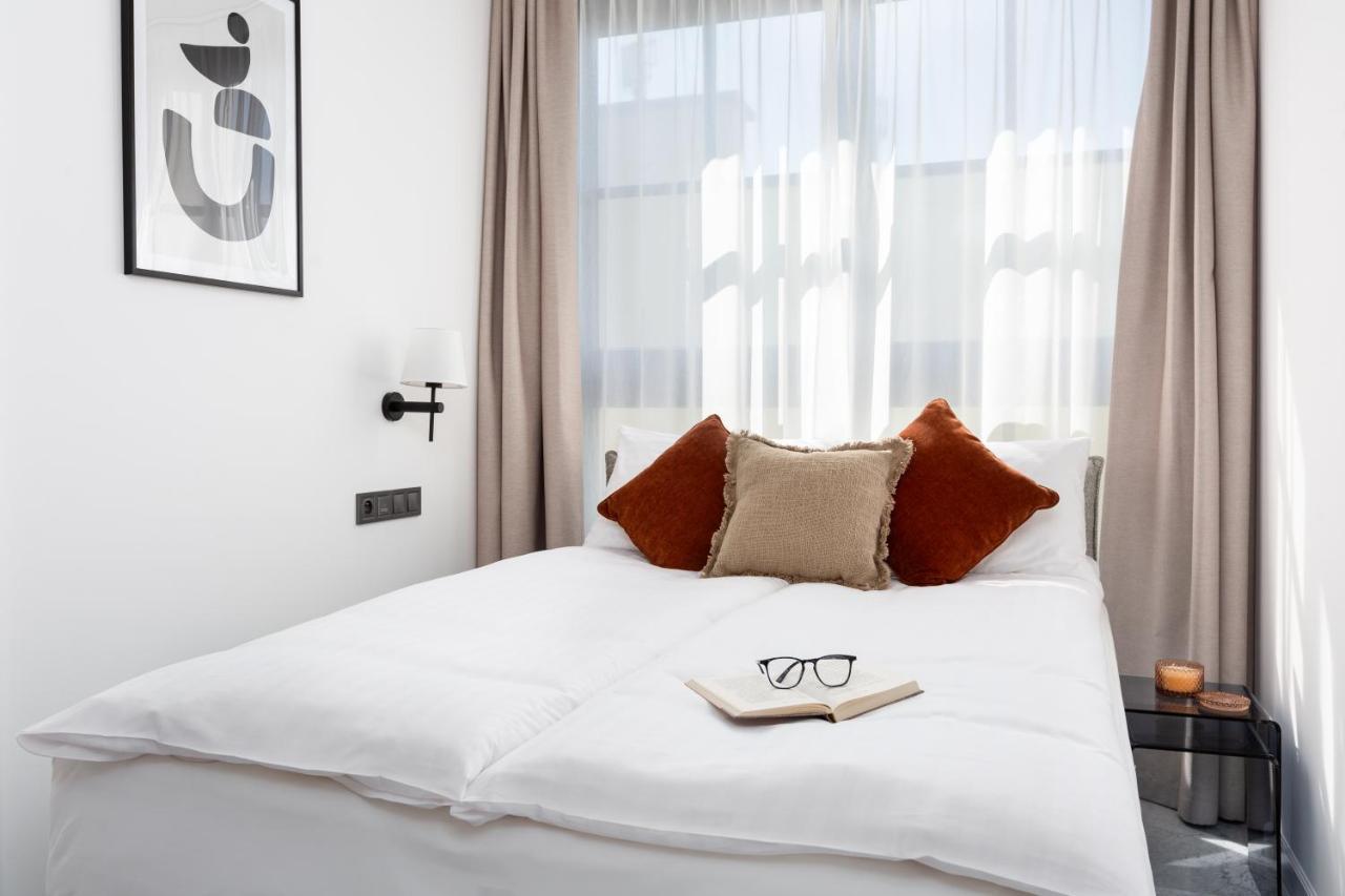 H11 Aparthotel Cracovia Esterno foto A bedroom