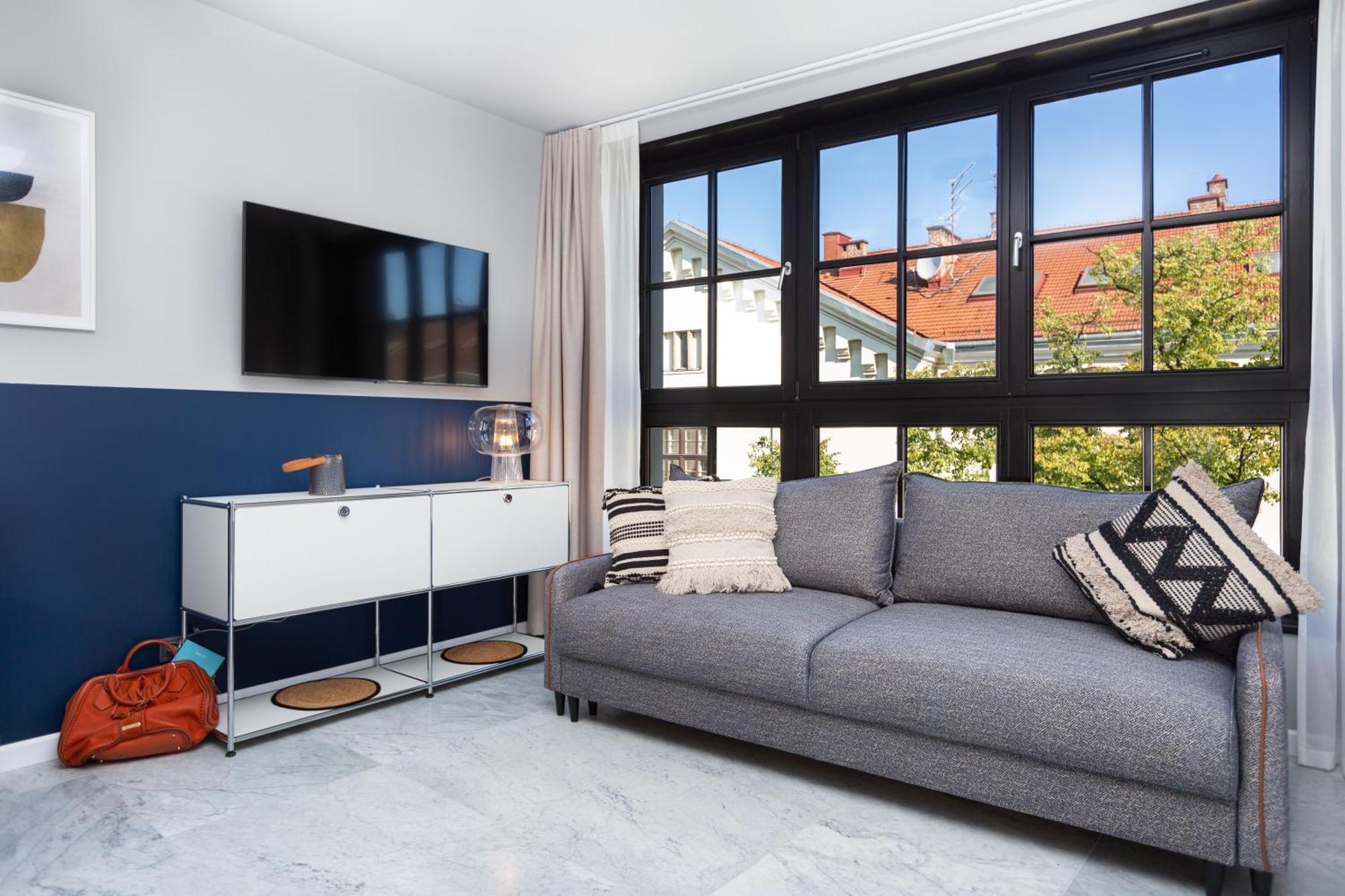 H11 Aparthotel Cracovia Camera foto A living room in a serviced apartment in Munich, Germany
